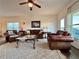 Comfortable living room with leather furniture and natural light at 5515 Allegre Pl, Cumming, GA 30028