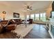 Bright living room featuring leather furniture, large windows, and a view of the outdoors at 5515 Allegre Pl, Cumming, GA 30028