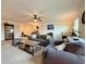 Spacious living area with neutral tones, comfortable seating, and ample natural light at 5515 Allegre Pl, Cumming, GA 30028