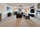 Expansive living room with a mix of seating, a ceiling fan, and great natural light at 5515 Allegre Pl, Cumming, GA 30028