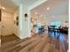 Open-concept living space with a kitchen, dining area, and cozy seating arrangement at 5515 Allegre Pl, Cumming, GA 30028