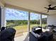 Relax on the covered patio with a ceiling fan and backyard views at 5515 Allegre Pl, Cumming, GA 30028