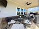 Covered patio with ceiling fan and wrought iron seating at 5515 Allegre Pl, Cumming, GA 30028