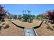 Community playground with mulch and mature trees nearby at 5515 Allegre Pl, Cumming, GA 30028