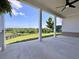 Covered porch overlooking a green lawn and fenced property at 5515 Allegre Pl, Cumming, GA 30028