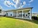A well-maintained yard leads to an attractive covered patio that enhances this charming home's appeal at 5515 Allegre Pl, Cumming, GA 30028