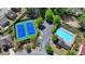 Aerial view of a community pool, clubhouse, tennis court and parking lot at 5976 Princeton Run Trl, Tucker, GA 30084