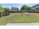A large backyard with grass, a garden area and a wood fence at 5976 Princeton Run Trl, Tucker, GA 30084