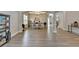Open-concept dining room area featuring contemporary light fixture and neutral paint at 5976 Princeton Run Trl, Tucker, GA 30084