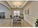 Dining room with neutral walls, trim, natural-colored flooring, and modern decor at 5976 Princeton Run Trl, Tucker, GA 30084