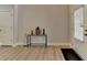 Hallway/Foyer with natural-colored flooring and light colored walls at 5976 Princeton Run Trl, Tucker, GA 30084