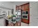 Gourmet kitchen features stainless steel appliances, granite countertops, and custom cabinetry at 5976 Princeton Run Trl, Tucker, GA 30084