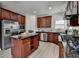 Gourmet kitchen features stainless steel appliances, granite countertops, and custom cabinetry at 5976 Princeton Run Trl, Tucker, GA 30084