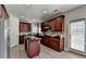 Gourmet kitchen features stainless steel appliances, granite countertops, and custom cabinetry at 5976 Princeton Run Trl, Tucker, GA 30084