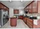 Gourmet kitchen features stainless steel appliances, granite countertops, and custom cabinetry at 5976 Princeton Run Trl, Tucker, GA 30084