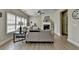 Bright and airy living room with large windows and contemporary furnishings at 5976 Princeton Run Trl, Tucker, GA 30084