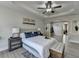 Comfortable main bedroom with tray ceiling, ceiling fan, lots of light, and modern decor at 5976 Princeton Run Trl, Tucker, GA 30084