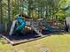 A wooden playground area for children with slides, swings, and climbing area at 5976 Princeton Run Trl, Tucker, GA 30084