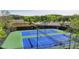 A view of the community's tennis courts in a fenced in area at 5976 Princeton Run Trl, Tucker, GA 30084