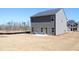Rear view of the home, showing a large, empty backyard at 685 Egrets Lot 58 Lndg, Covington, GA 30014