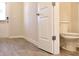 Bathroom featuring a toilet and an open door to the outside at 685 Egrets Lot 58 Lndg, Covington, GA 30014