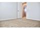 Bedroom with neutral walls, white trim, carpeted floors, and open doorway to hall at 685 Egrets Lot 58 Lndg, Covington, GA 30014