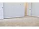 A bedroom with neutral carpet and white trim at 685 Egrets Lot 58 Lndg, Covington, GA 30014