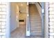 Inviting entryway featuring wood-look floors and a staircase leading to the second floor at 685 Egrets Lot 58 Lndg, Covington, GA 30014