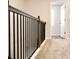 Stairway landing featuring carpeted floors and dark wood trim at 685 Egrets Lot 58 Lndg, Covington, GA 30014