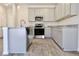 Well-equipped kitchen boasting stainless steel appliances, gray cabinetry, and granite countertops at 685 Egrets Lot 58 Lndg, Covington, GA 30014