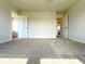 Bedroom with carpeting, light colored walls, and a partial view of the ensuite bathroom at 685 Egrets Lot 58 Lndg, Covington, GA 30014