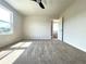 Bedroom with light colored walls, carpeting and a bathroom view at 685 Egrets Lot 58 Lndg, Covington, GA 30014