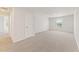 Spacious loft area with neutral carpet, closet, a window, and an open view of the second floor at 7099 Brushwood Bend (Lot 49), Lithonia, GA 30058