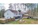 Spacious backyard with a pool, fire pit, patio area, basketball court, and a lush green lawn at 1074 Fieldstone Dr, Canton, GA 30114