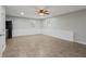A spacious basement area with tile floors, white walls, and natural light from the windows at 1074 Fieldstone Dr, Canton, GA 30114
