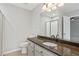 Bathroom featuring granite countertops, stylish mirrors, a toilet, and a stand-up shower at 1074 Fieldstone Dr, Canton, GA 30114