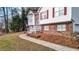 A charming two-story home with red shutters, brick accents, and a well-manicured front yard at 1074 Fieldstone Dr, Canton, GA 30114