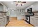 Bright, well-equipped kitchen with stainless steel appliances and hardwood floors at 1074 Fieldstone Dr, Canton, GA 30114