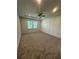 Bright bedroom featuring a ceiling fan, natural light, and a neutral-toned carpet at 2108 Amaryllis Dr, Grayson, GA 30017