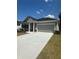 Attractive exterior view of a single-Gathering home with a two-car garage and a manicured lawn at 2108 Amaryllis Dr, Grayson, GA 30017