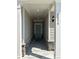 Welcoming front entrance with a stone base, gray siding, and a teal front door at 2108 Amaryllis Dr, Grayson, GA 30017