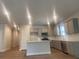 Modern kitchen features stainless steel appliances, a center island, and plenty of counter space for cooking and entertaining at 2108 Amaryllis Dr, Grayson, GA 30017
