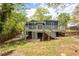 Charming home featuring a spacious deck, perfect for outdoor entertaining and relaxation in a lush backyard setting at 2724 Bomar Rd, Douglasville, GA 30135
