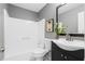 Cozy bathroom featuring a shower-tub combo, modern vanity, and neutral wall color at 2724 Bomar Rd, Douglasville, GA 30135