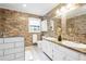 Gorgeous bathroom featuring brick walls, modern vanity, and updated fixtures at 2724 Bomar Rd, Douglasville, GA 30135