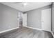 Spacious bedroom with neutral paint, modern vinyl floors, and plenty of natural light at 2724 Bomar Rd, Douglasville, GA 30135