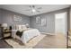 Comfortable bedroom with a ceiling fan, soft rug, and calming gray walls at 2724 Bomar Rd, Douglasville, GA 30135
