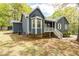 Charming home featuring a blue exterior, white trim, bay window and lovely stone accents on the foundation at 2724 Bomar Rd, Douglasville, GA 30135