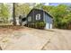 Lovely home with an attached two-car garage and a long driveway surrounded by mature landscaping and natural light at 2724 Bomar Rd, Douglasville, GA 30135