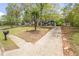 Landscaped front yard with a long driveway and mailbox at 2724 Bomar Rd, Douglasville, GA 30135